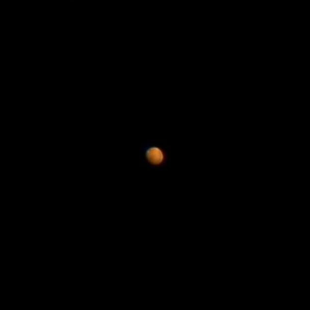 Mars showing a polar ice cap and dark surface markings